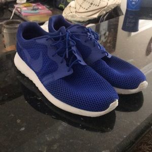 Blue pair of Nike Roshes